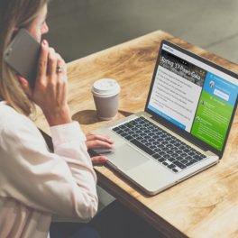 Woman on phone call while working at the desk